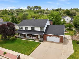 Spacious home with 7 bedrooms, 5 bathrooms, 4 car garage, RV pad, and .34 acres!