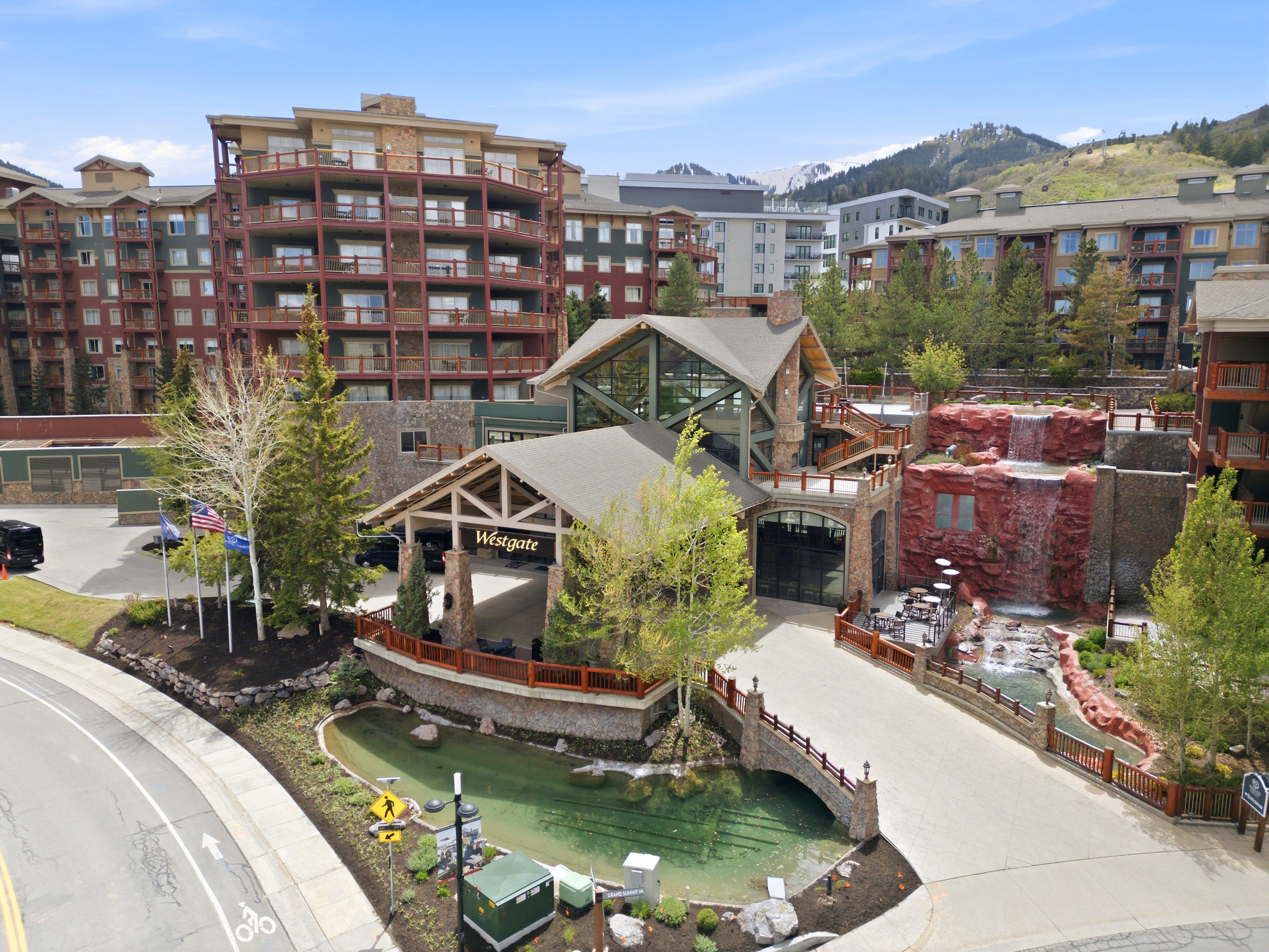 Mountain resort architecture featuring multiple buildings with stone and wood accents