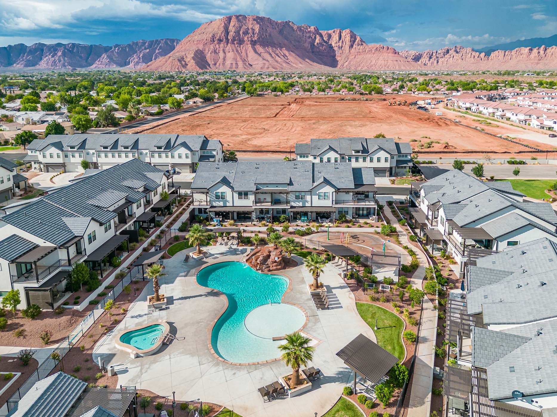 Community amenities featuring a resort-style swimming pool, separate spa, and dedicated playground area