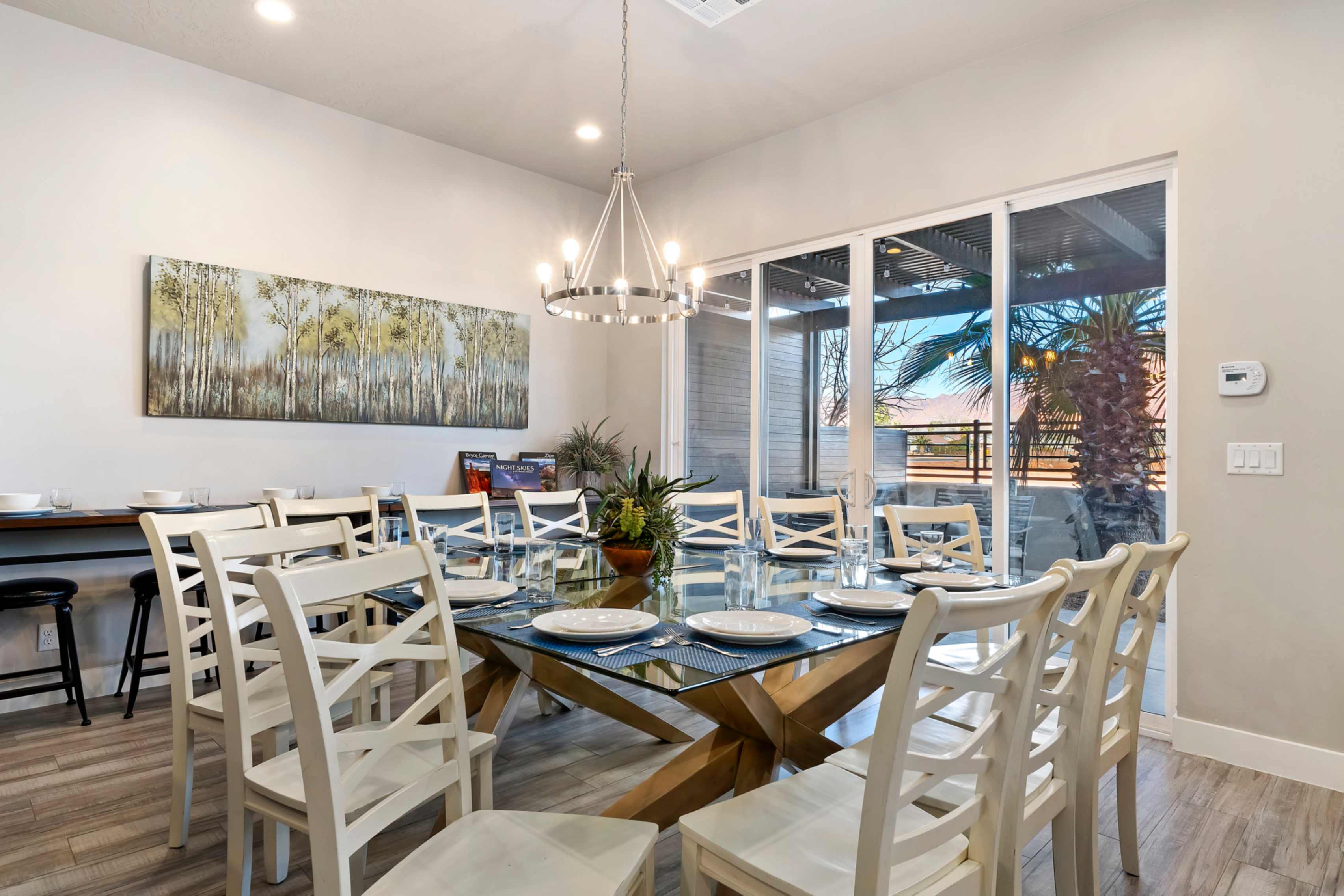 Open-concept dining area featuring wood-finish flooring and recessed lighting