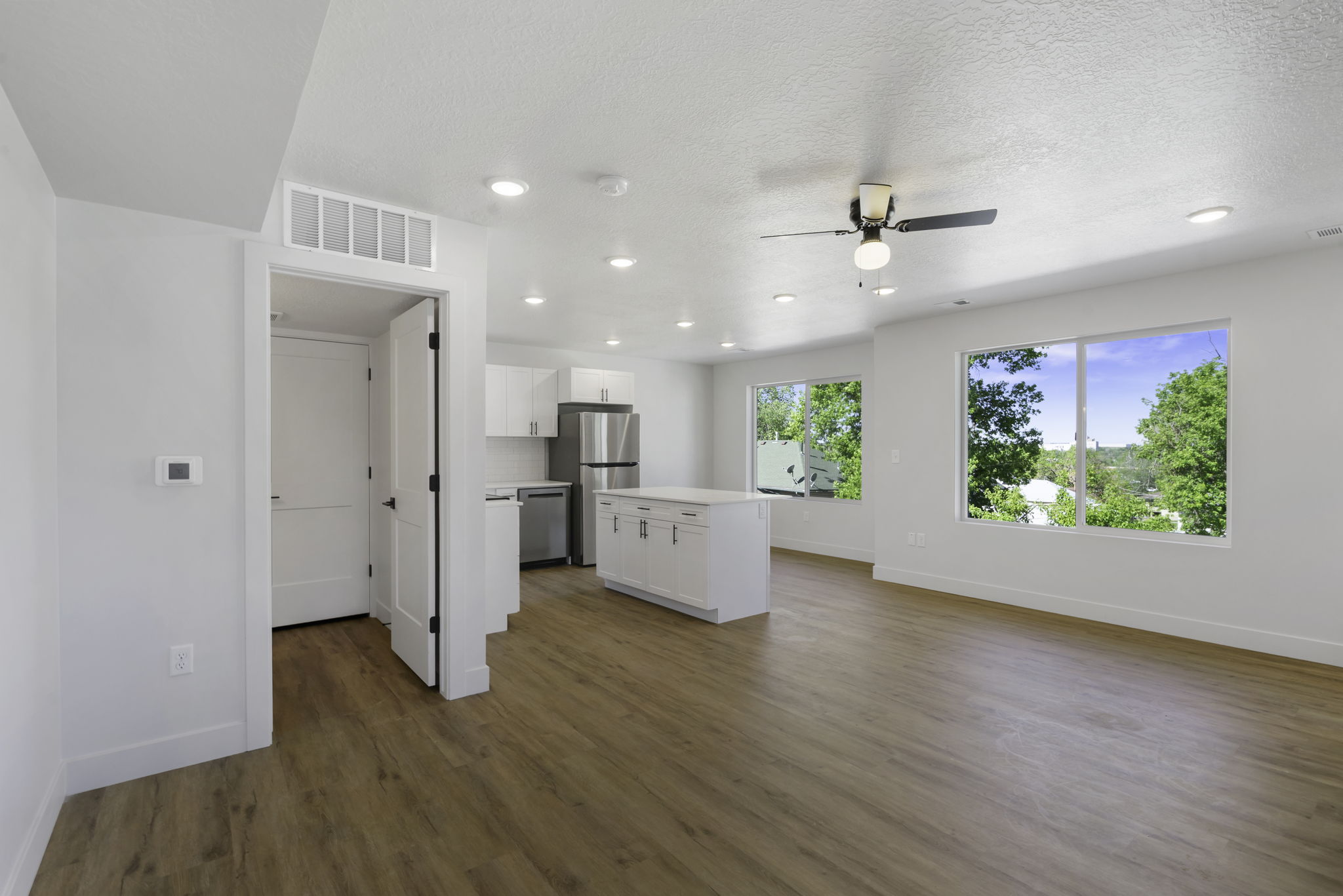 Open kitchen, dining, and living space