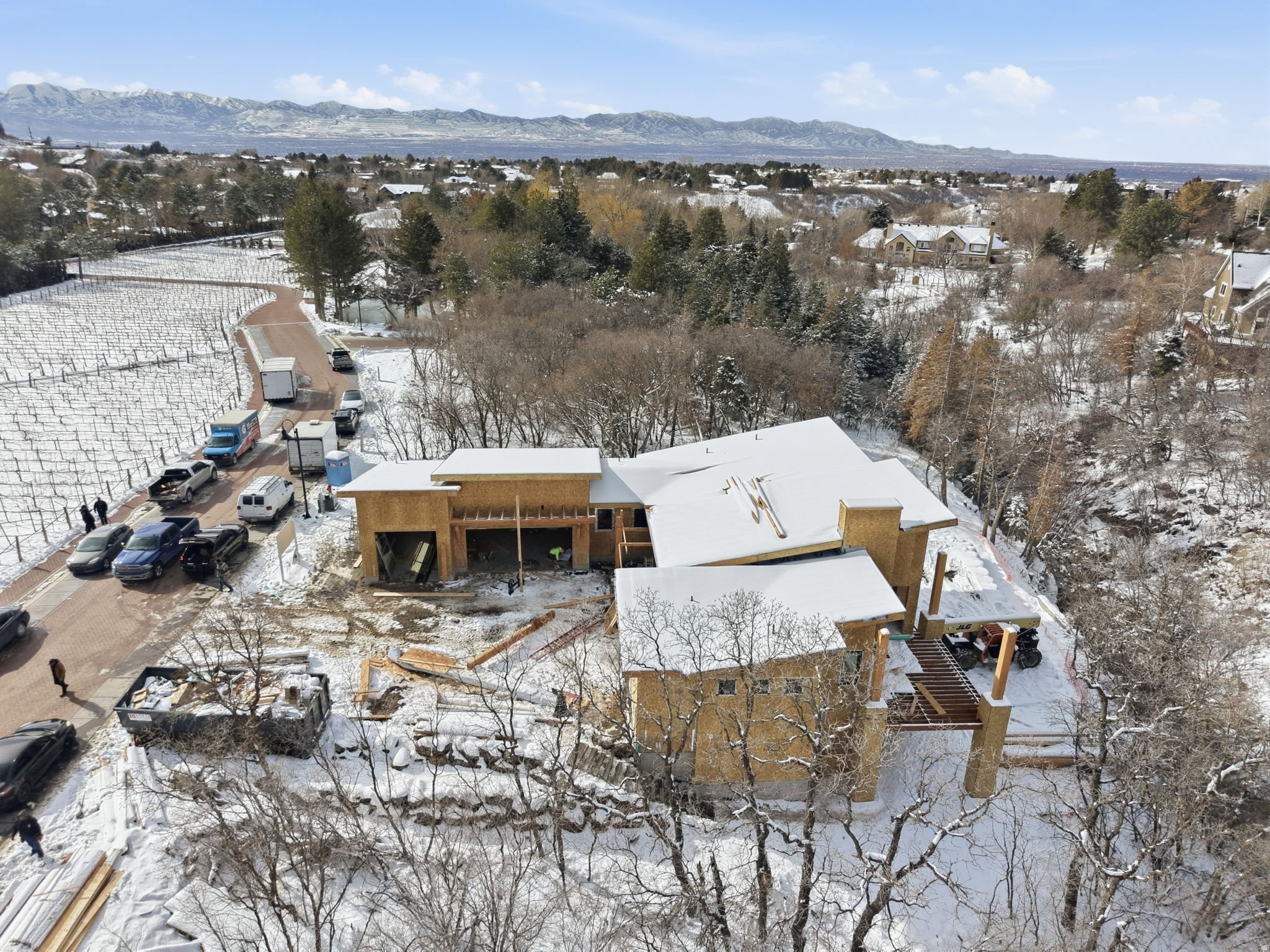 Newly constructed multi-level residence with framed exterior and roofing structure