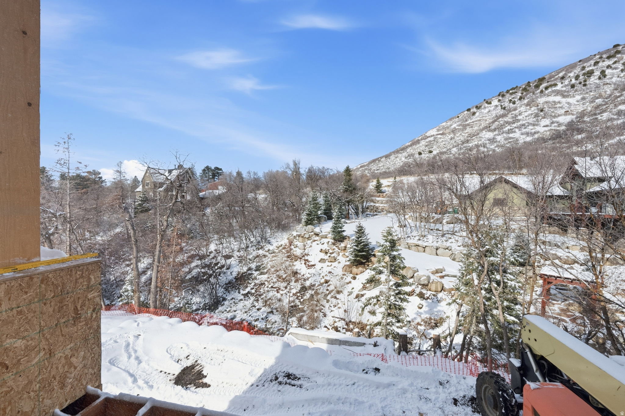 Expansive mountain scenery featuring natural rock formations and a snow-covered landscape