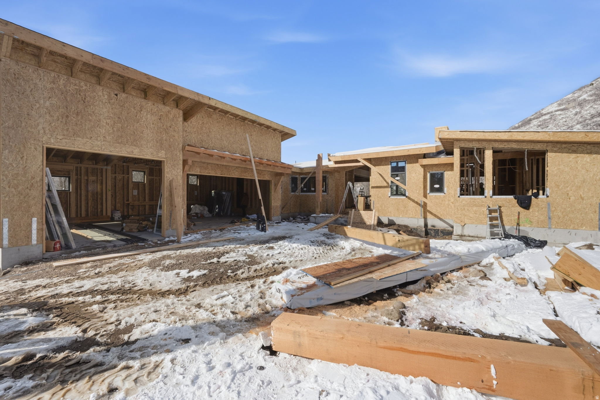 New construction property featuring a spacious two-car garage opening and a multi-level architectural design