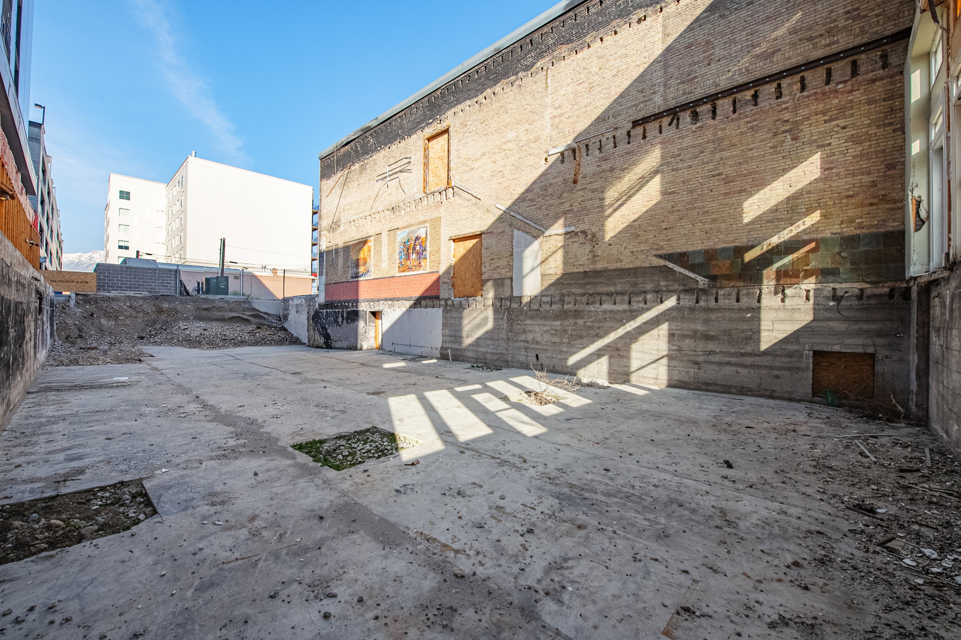 Expansive concrete pad surrounded by brick and concrete walls