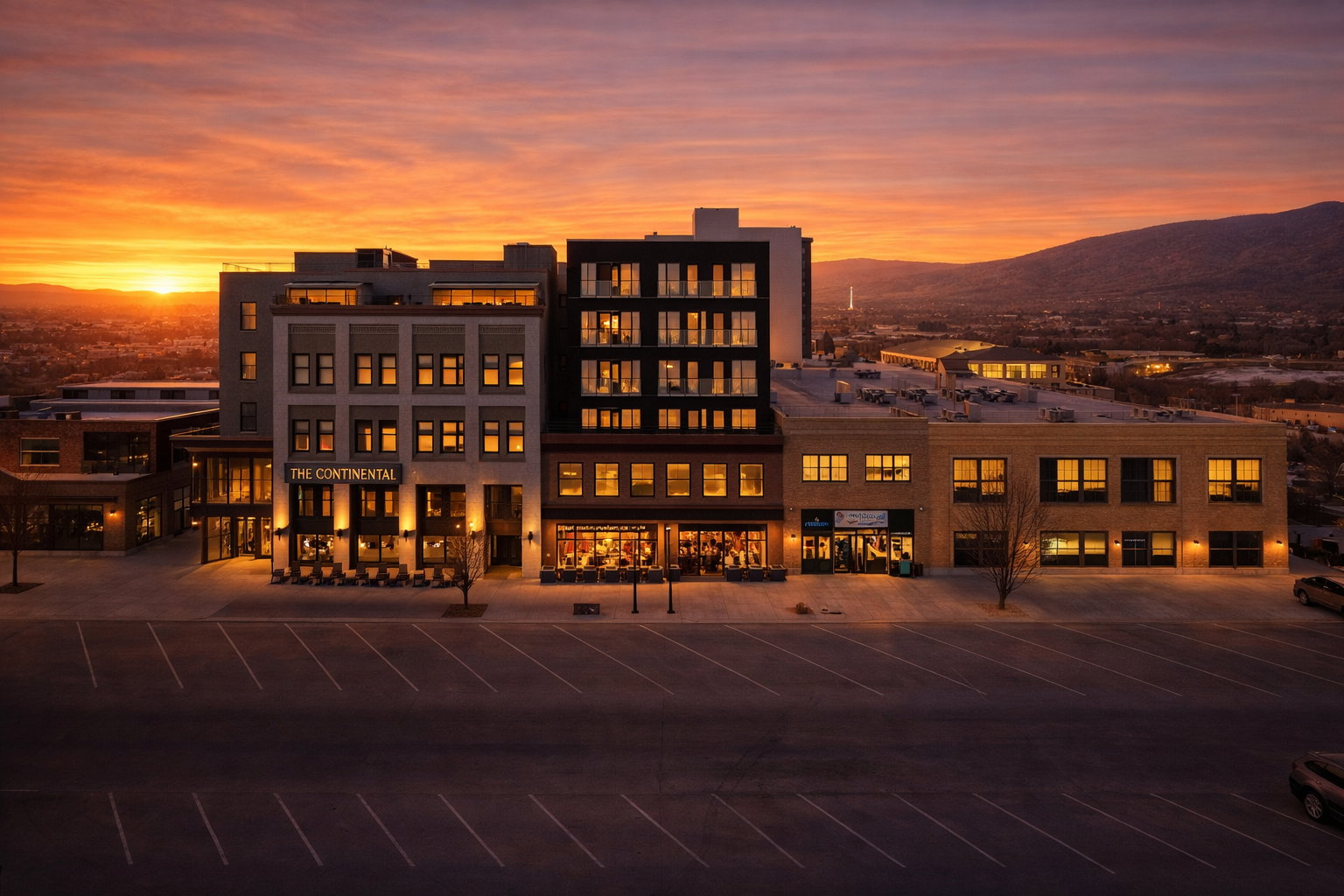 Modern multi-story commercial building featuring a diverse facade and expansive windows