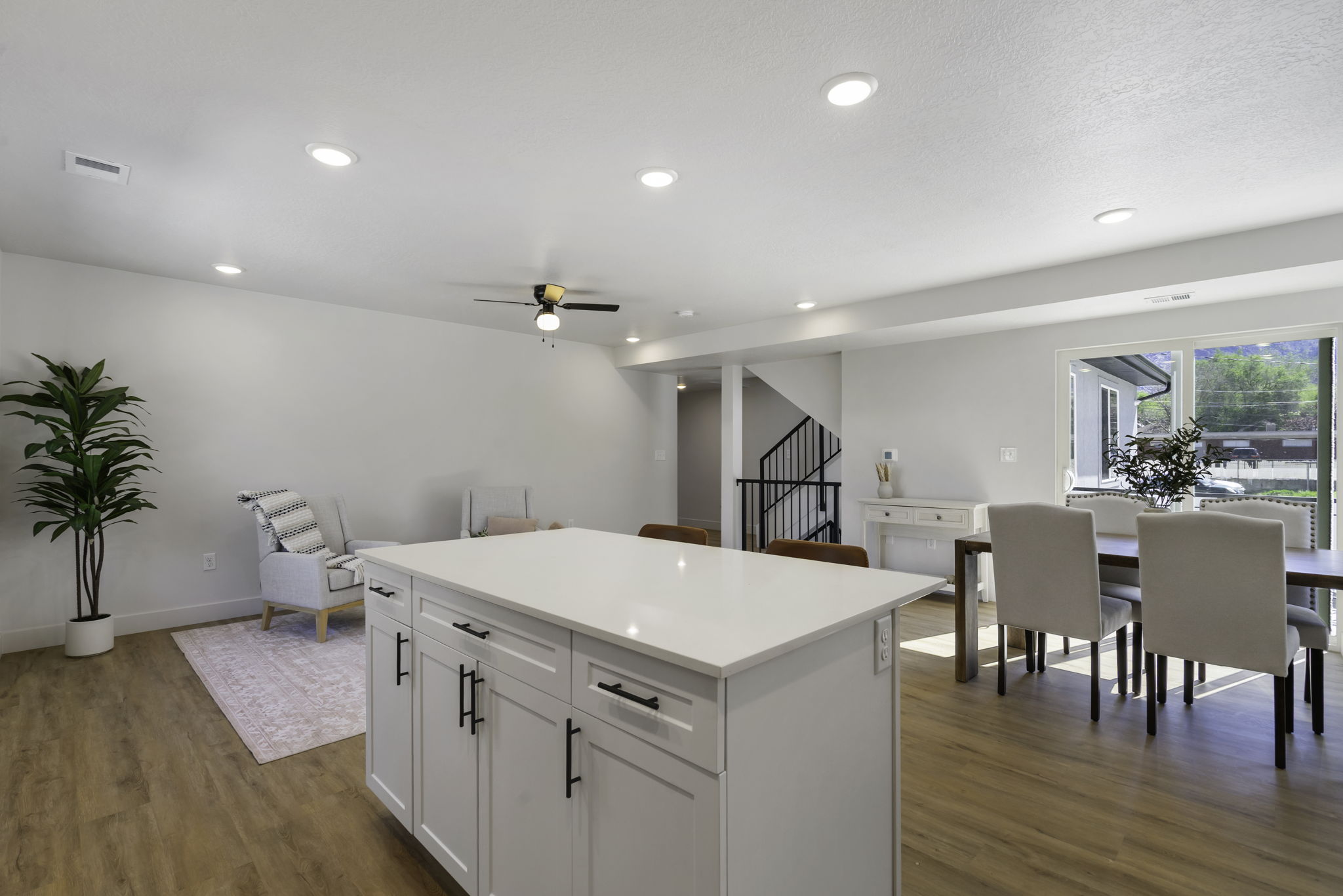 Bright interior featuring recessed lighting and wood-finish flooring