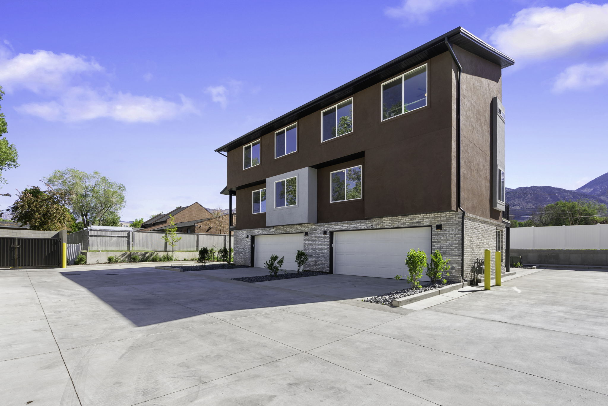 Garage door on the right and parking area