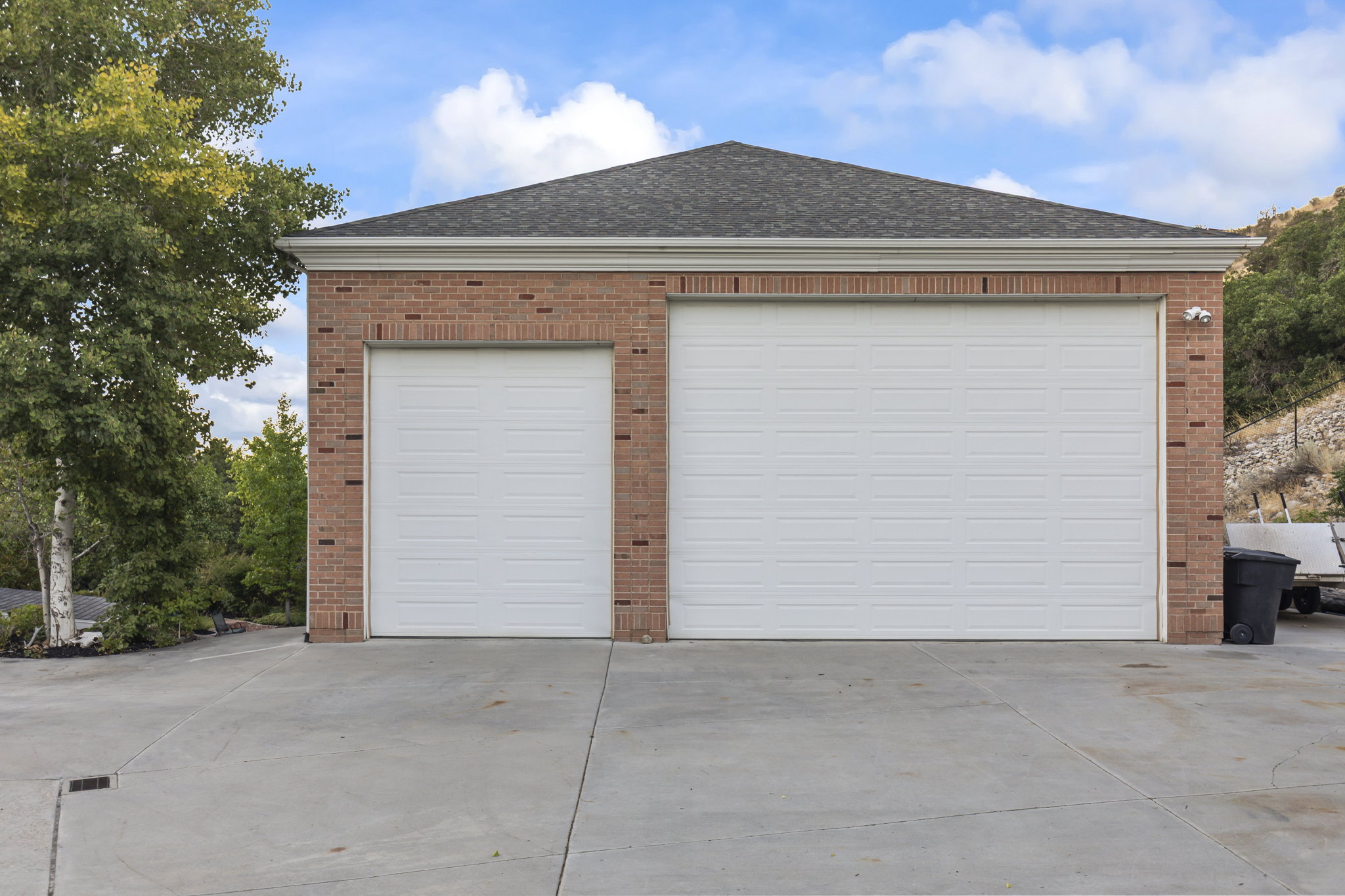 Garage featuring concrete driveway