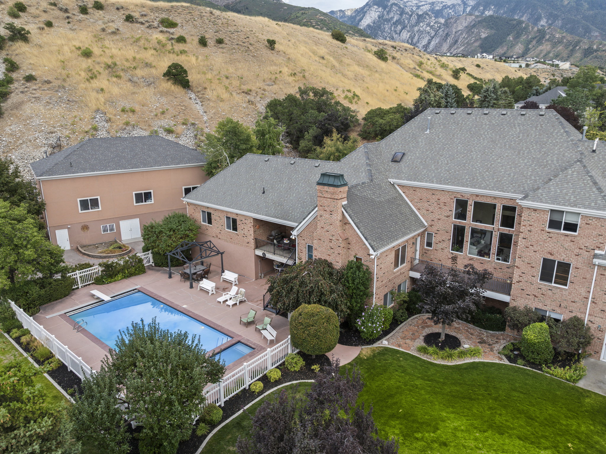 Aerial view of a mountainous background and a pool area