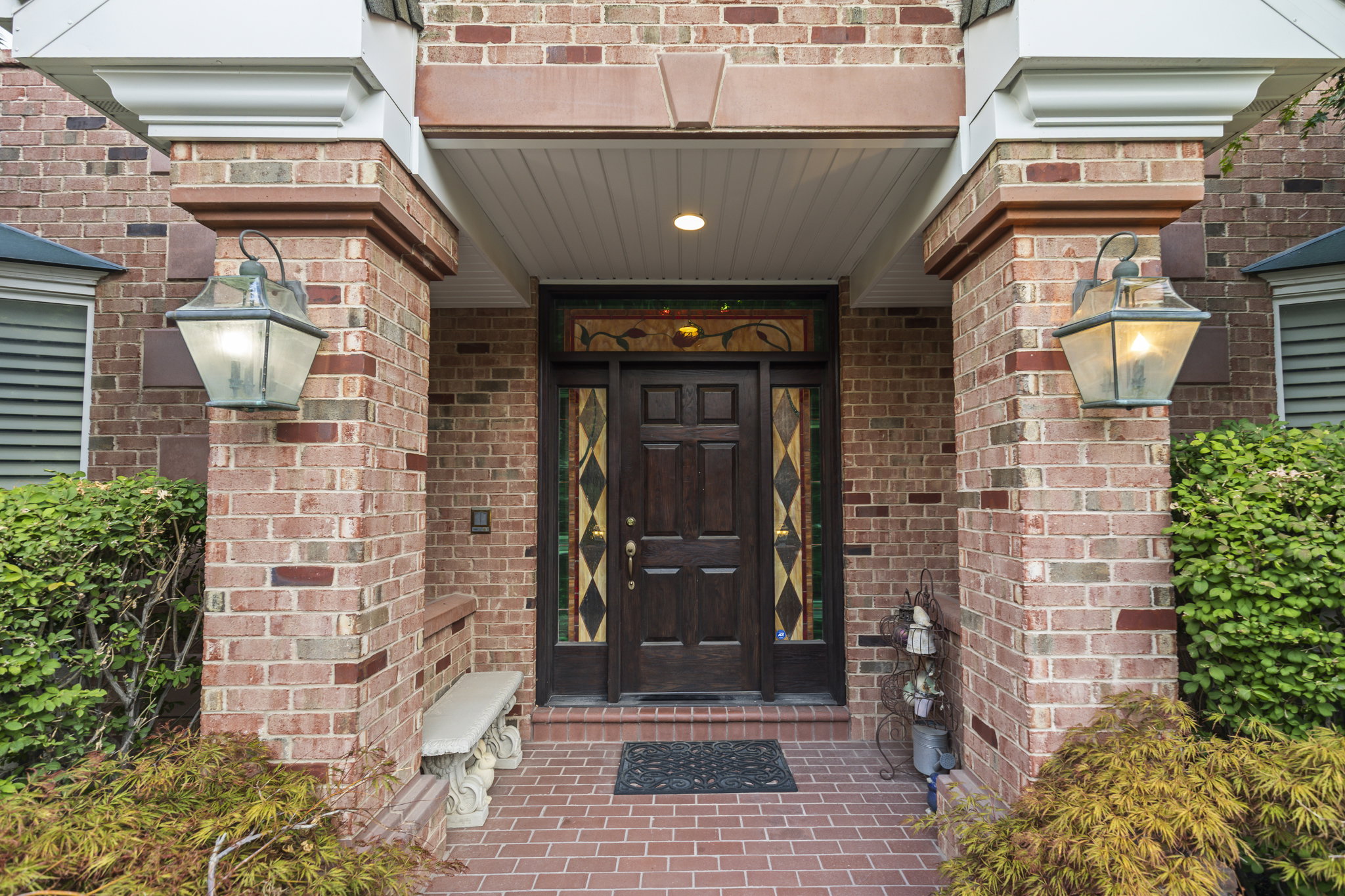 View of exterior entry featuring brick siding