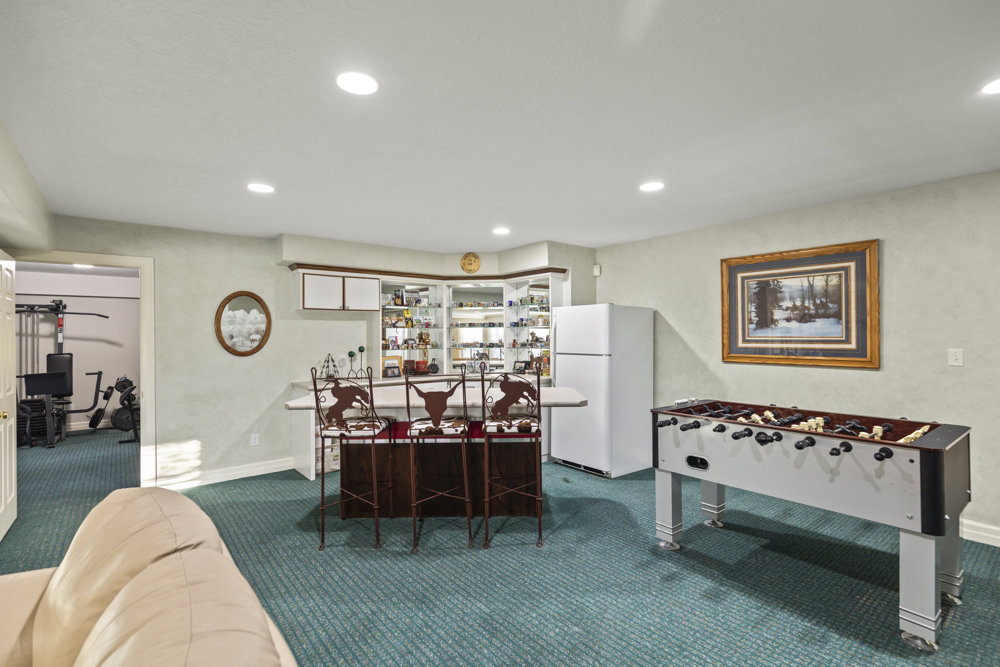 Recreation room featuring carpet flooring, recessed lighting, and a dry bar