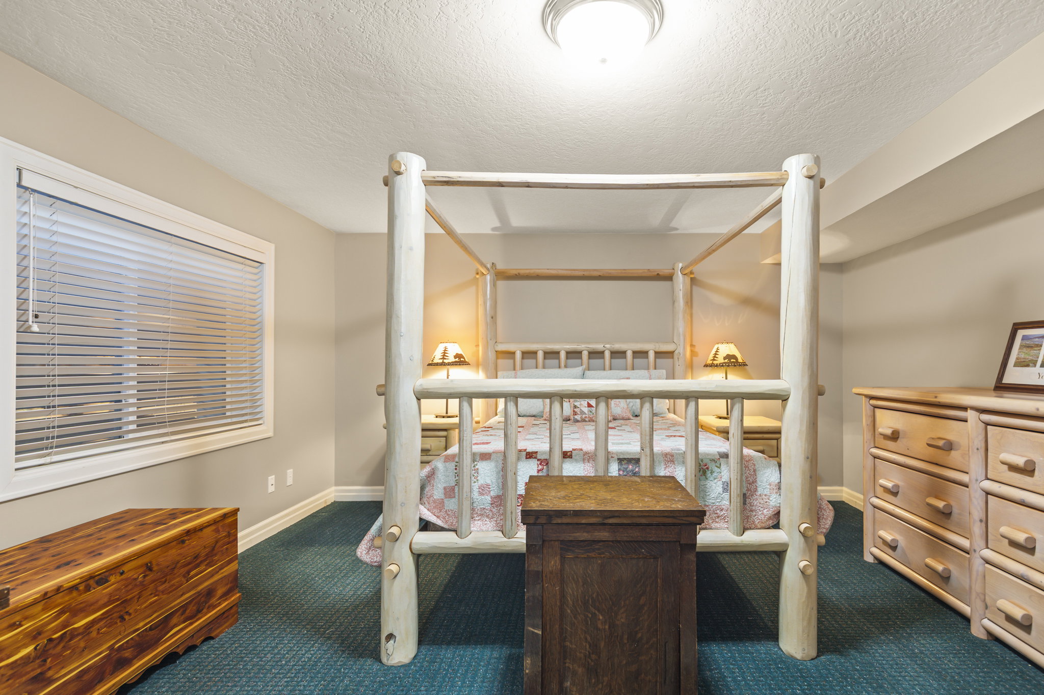 Carpeted bedroom featuring a textured ceiling