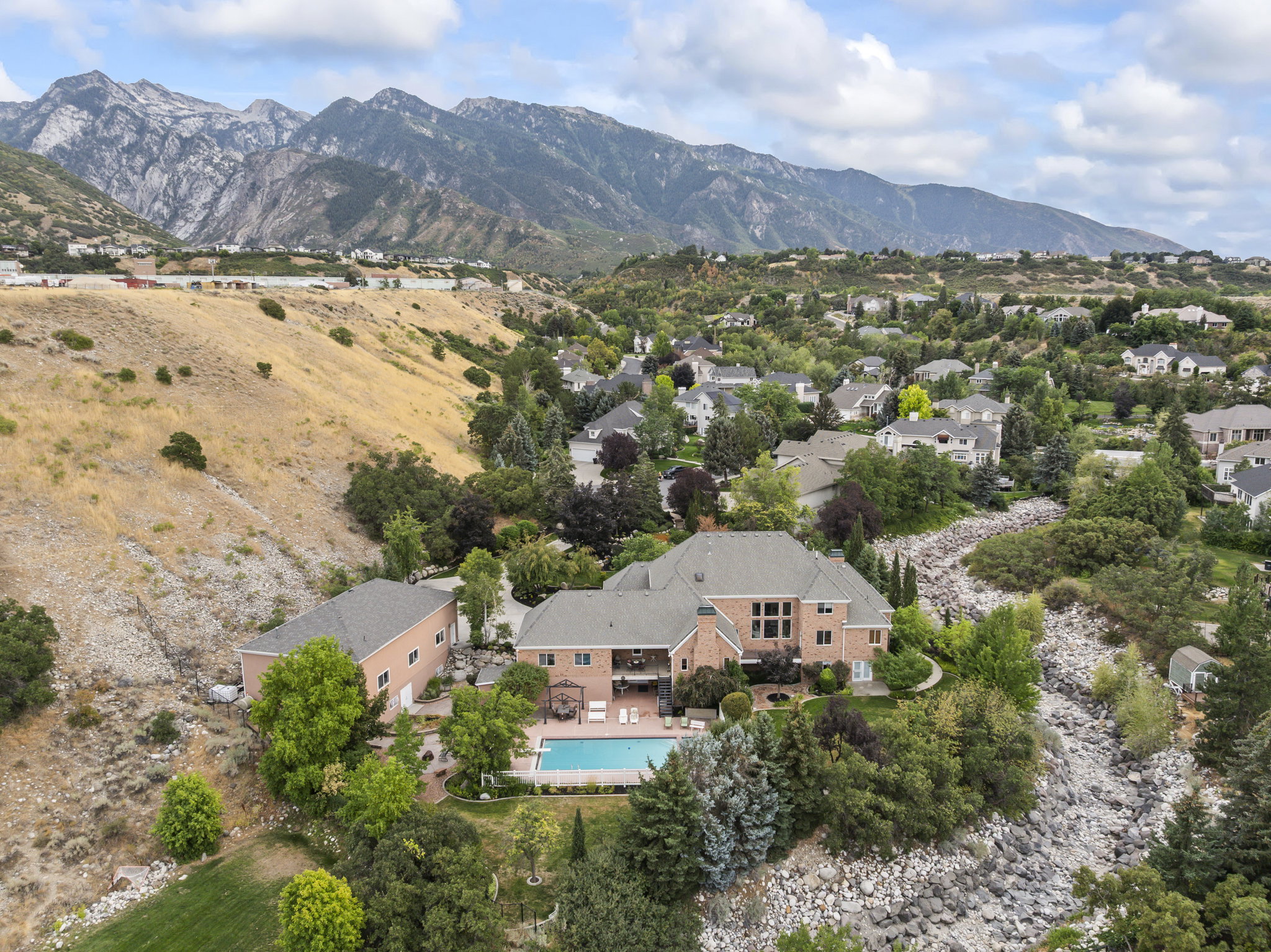 View of subject property with a mountain backdrop