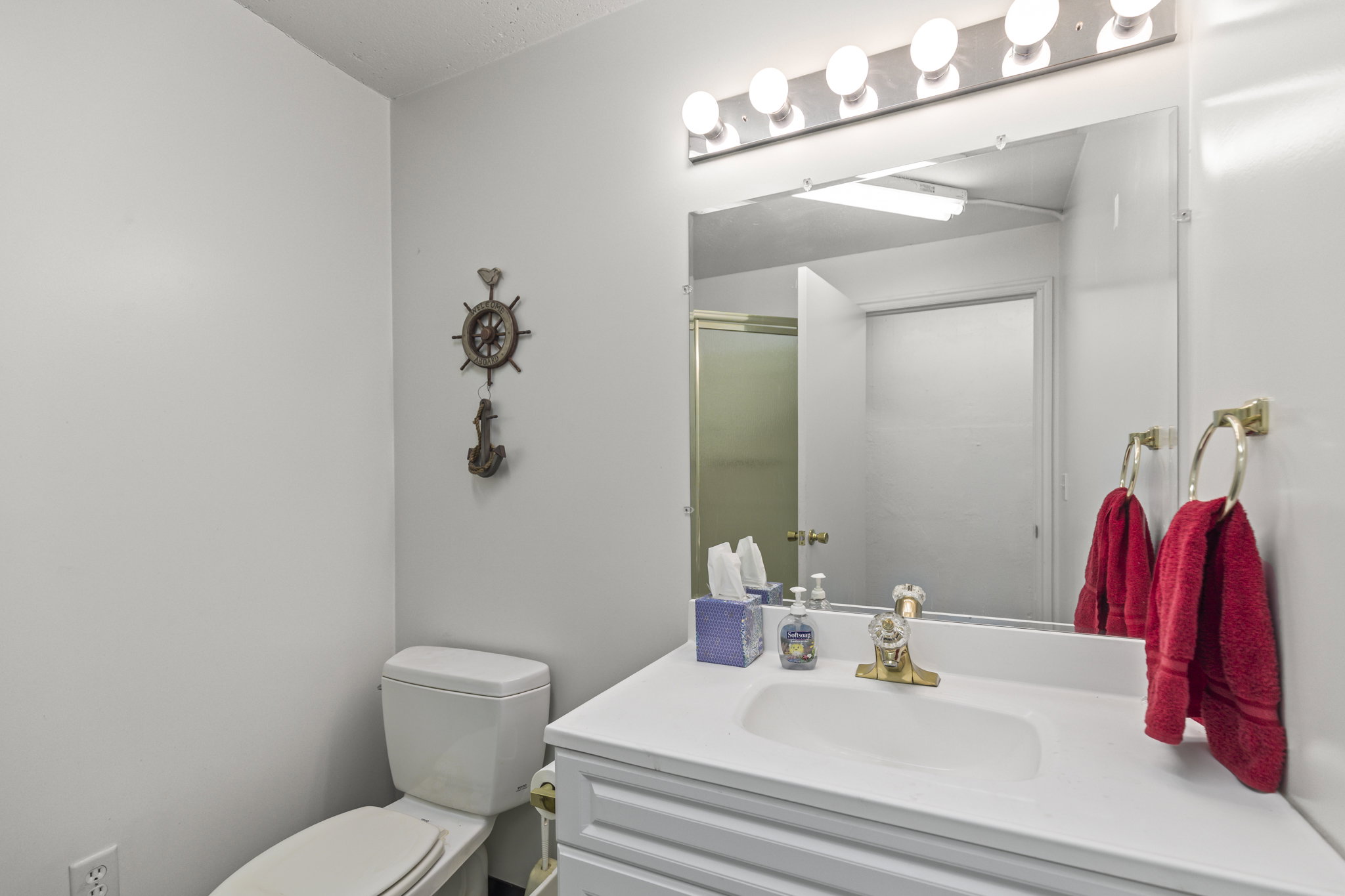 Full bath featuring vanity and a stall shower