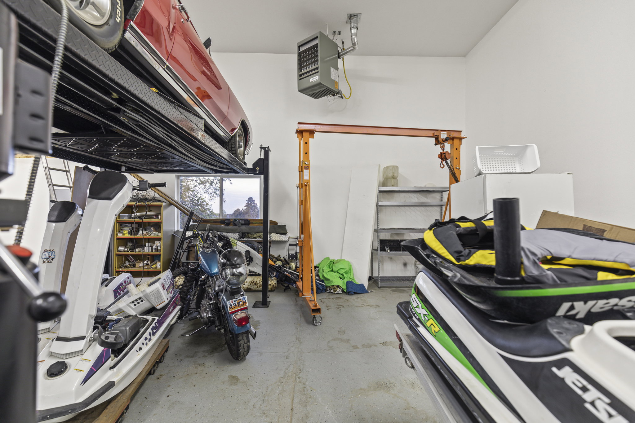 Garage featuring a heating unit