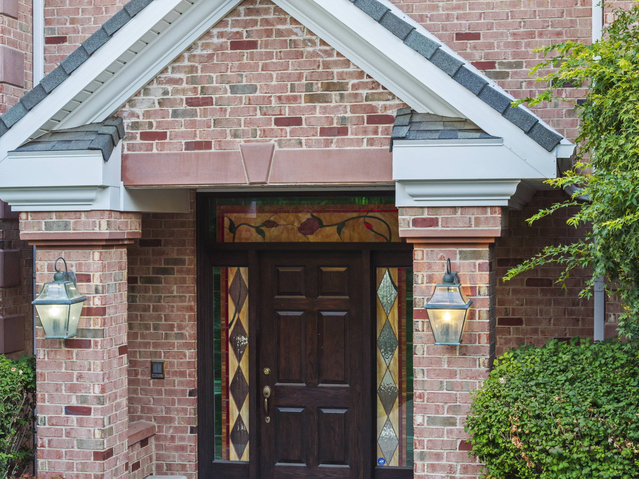 Entrance to property with brick siding