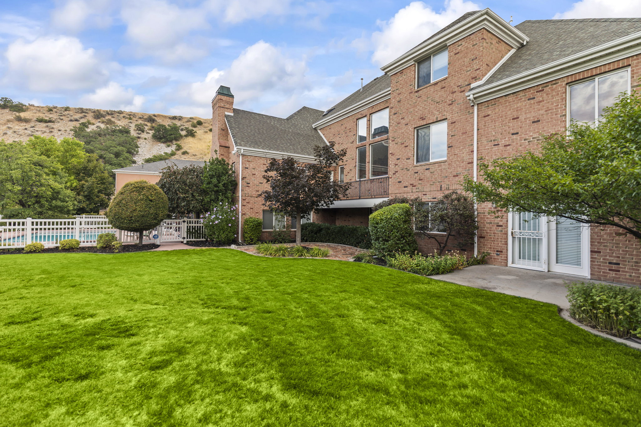 View of yard with a balcony