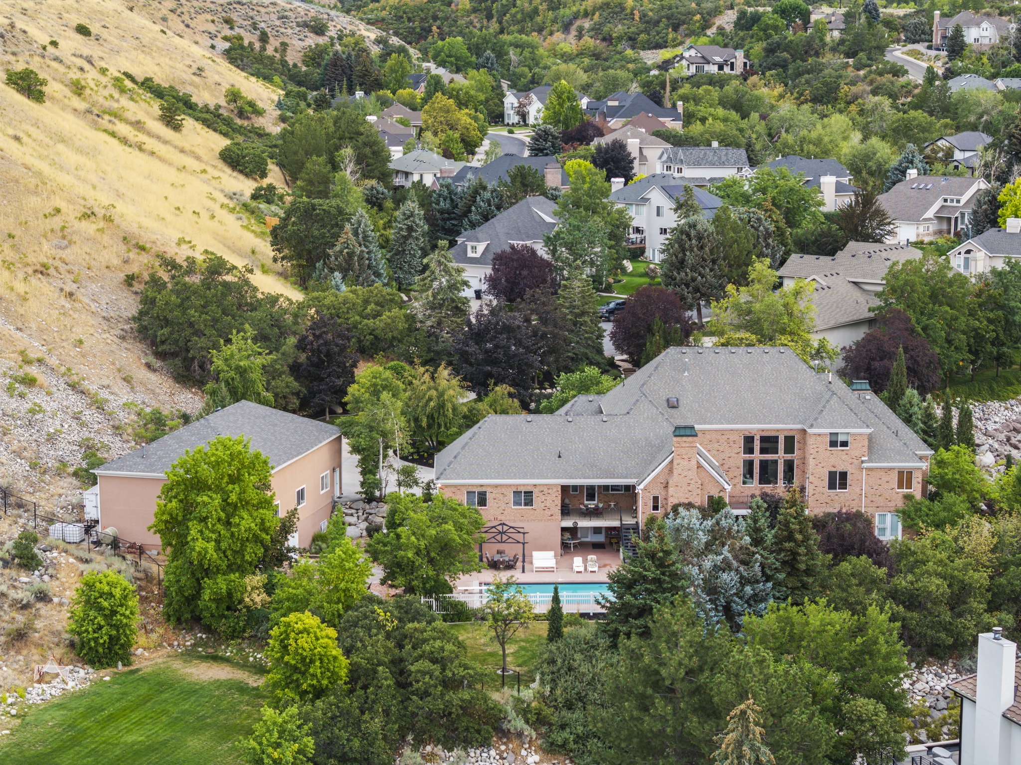 Aerial perspective of suburban area with a pool area