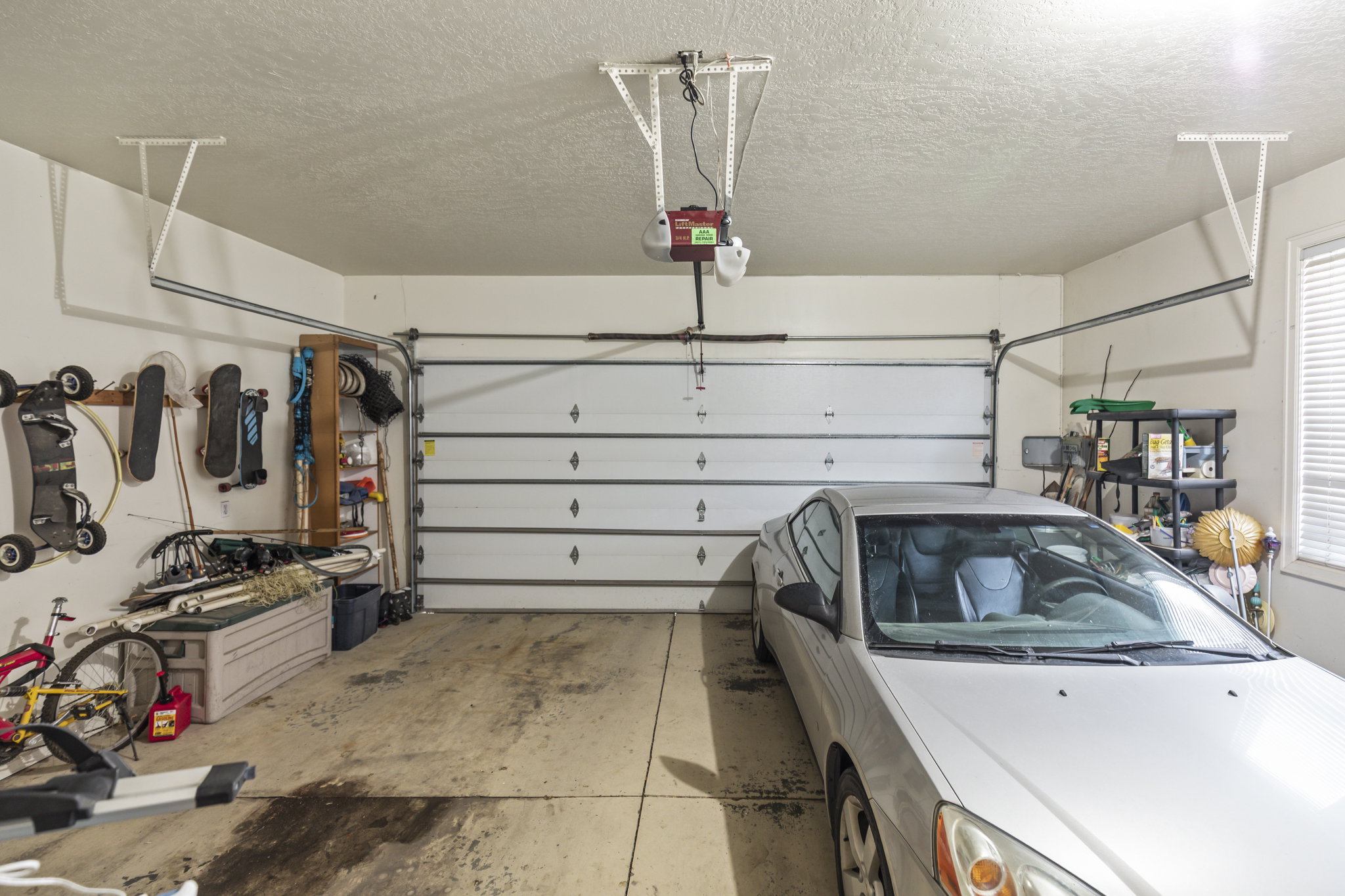 Garage featuring a garage door opener