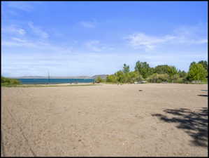 Expansive sandy beach area with direct water access