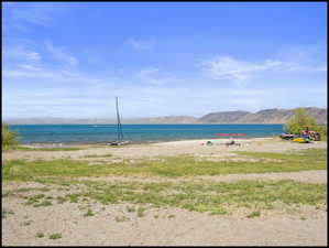 Expansive waterfront property featuring a sandy shoreline of Bear Lake