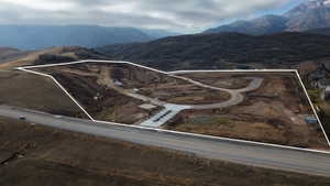 Expansive undeveloped land parcel with mountain backdrop