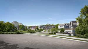 Residential community entrance featuring a stone-clad sign with "THE RANGE" lettering