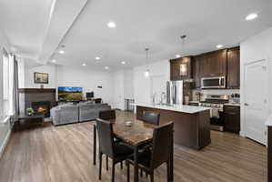 Open-concept main living area with wood-finish flooring