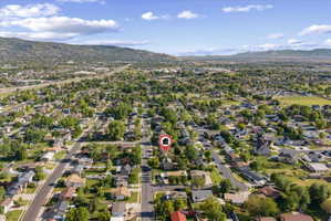 Aerial view showcasing a residential neighborhood with established streets and mature trees