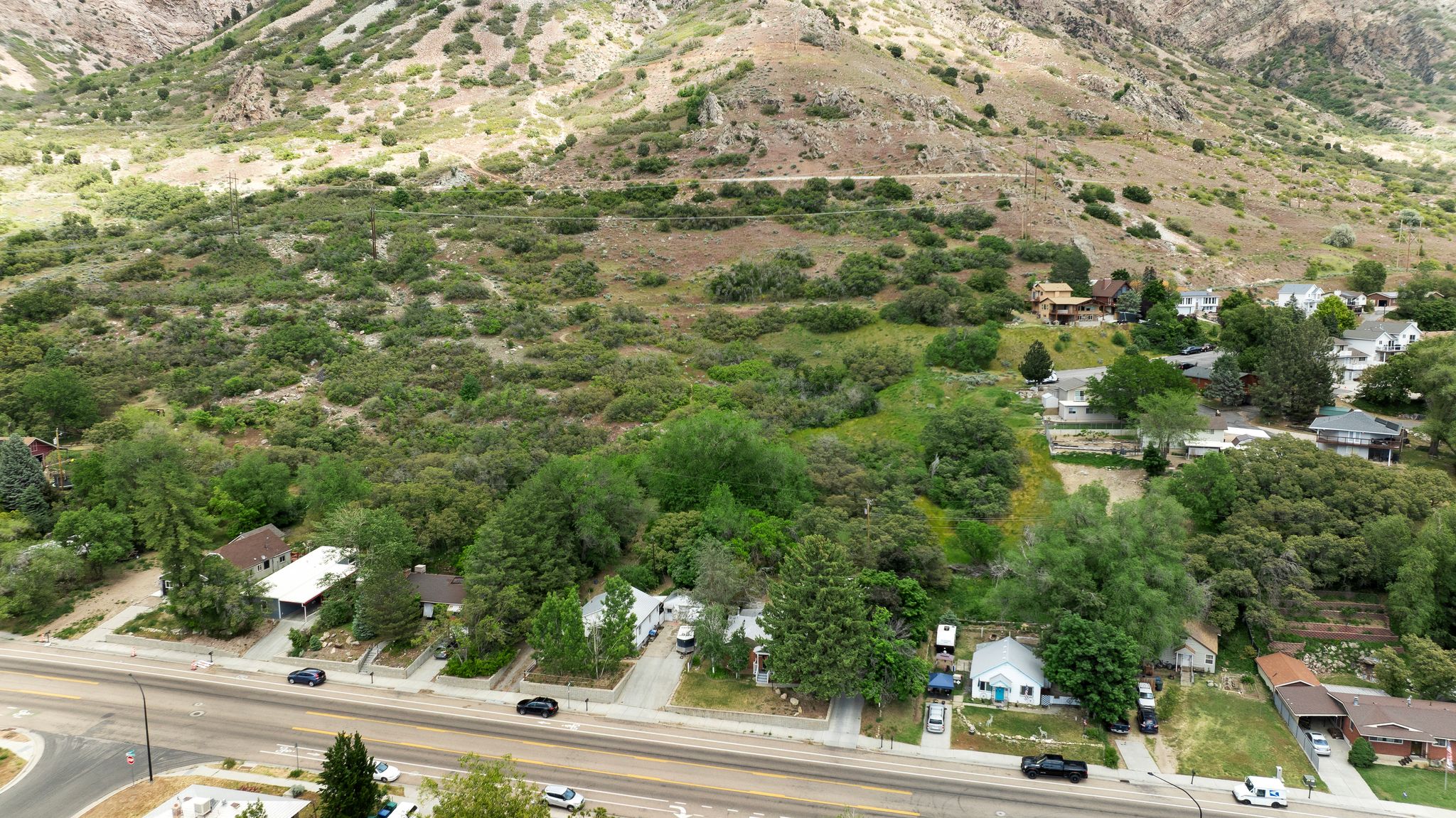 Expansive land parcel featuring dense natural vegetation and a mountainous backdrop
