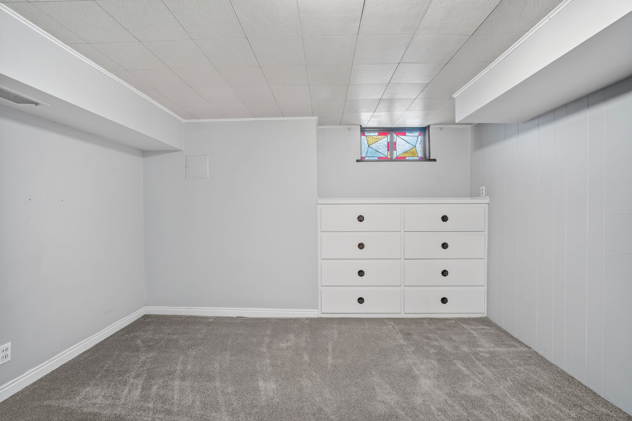 Recessed window featuring stained glass accents