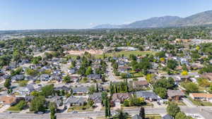 Aerial perspective showcasing a residential neighborhood with varied architectural styles and mature landscaping