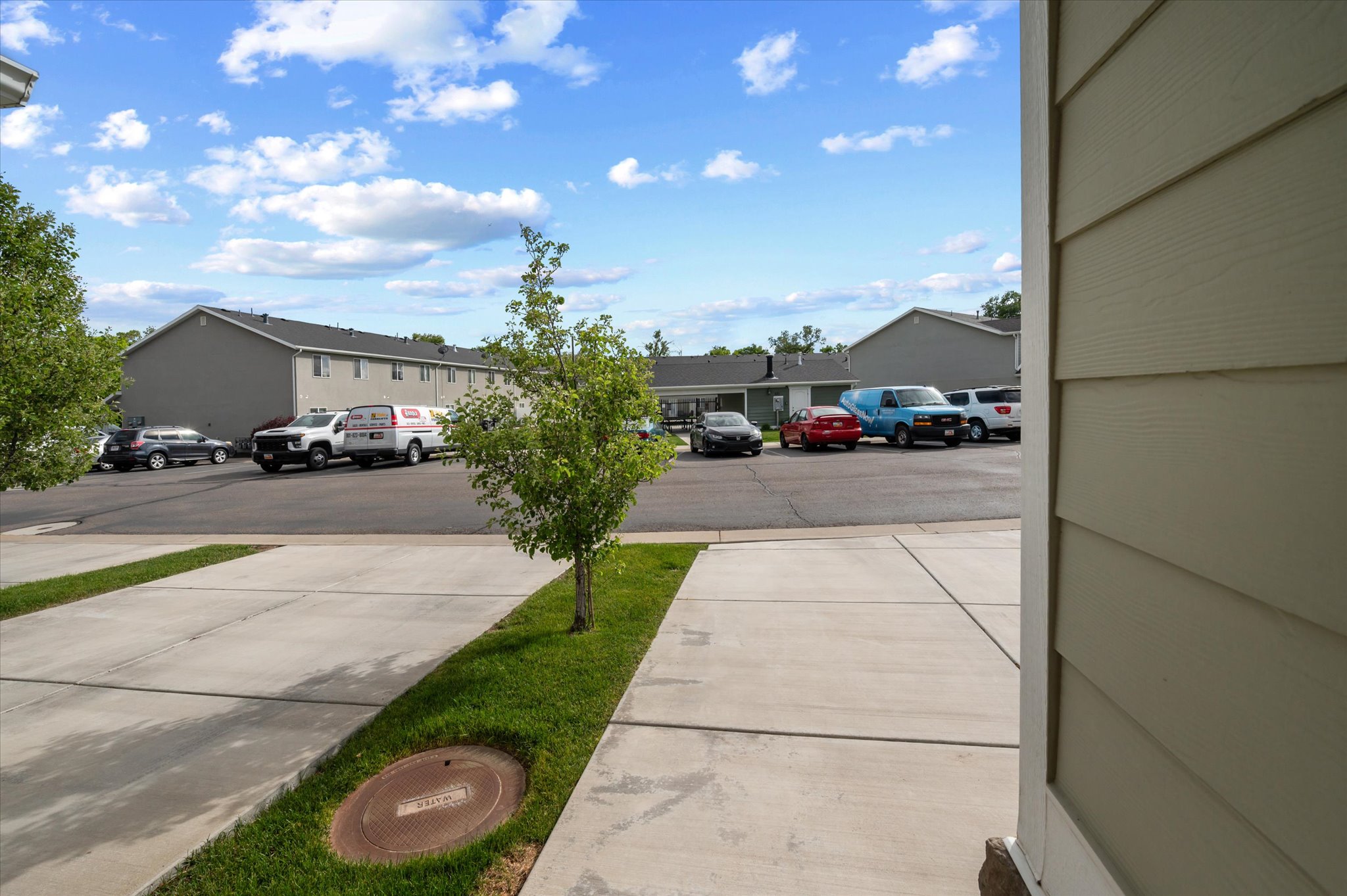 Paved concrete driveways with interspersed grassy strips