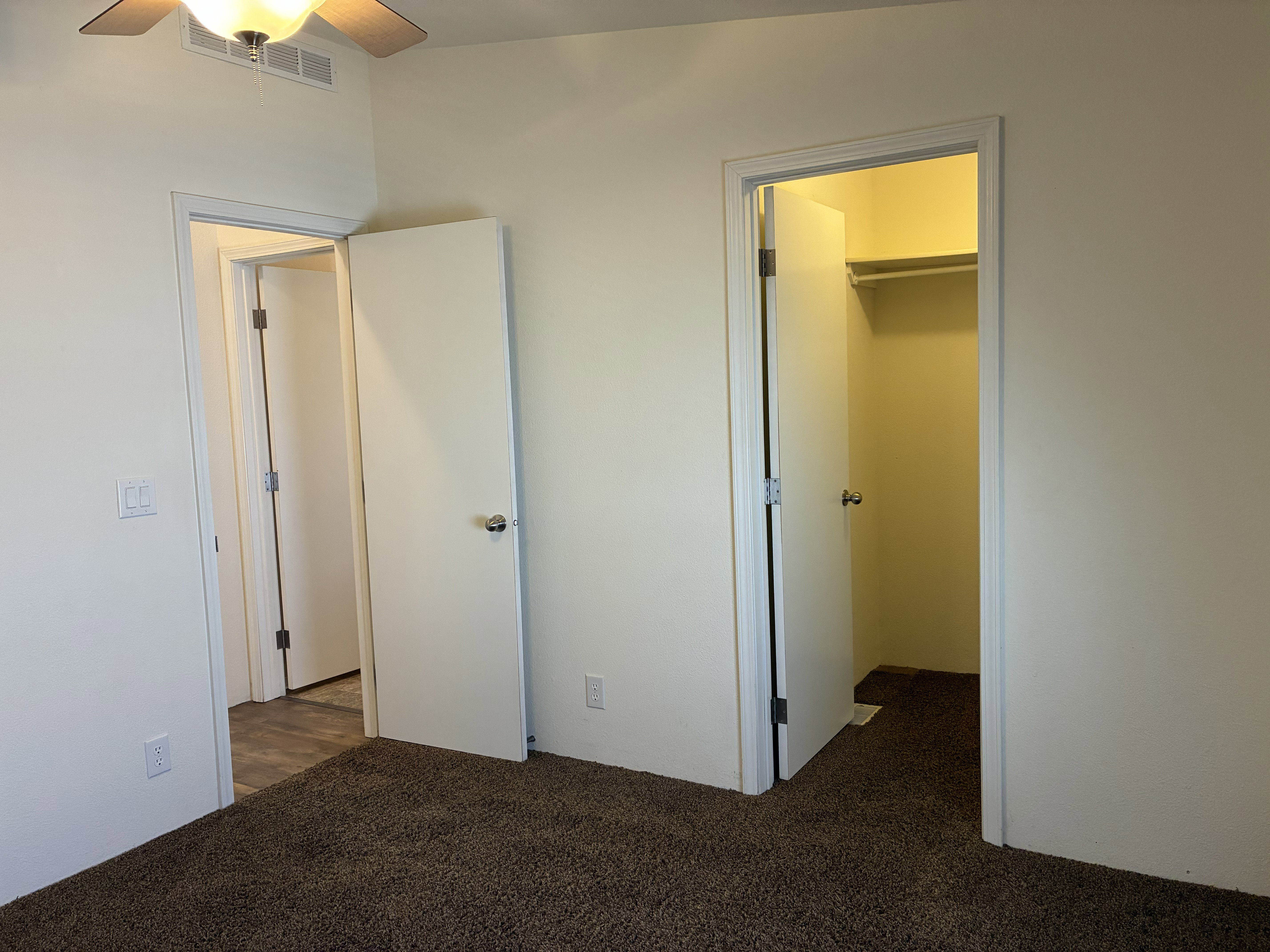 Bedroom 2 with a ceiling fan with light fixture