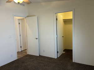 Bedroom 2 with a ceiling fan with light fixture