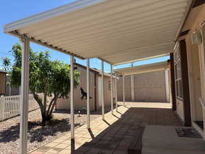Extensive covered patio with brick paver flooring