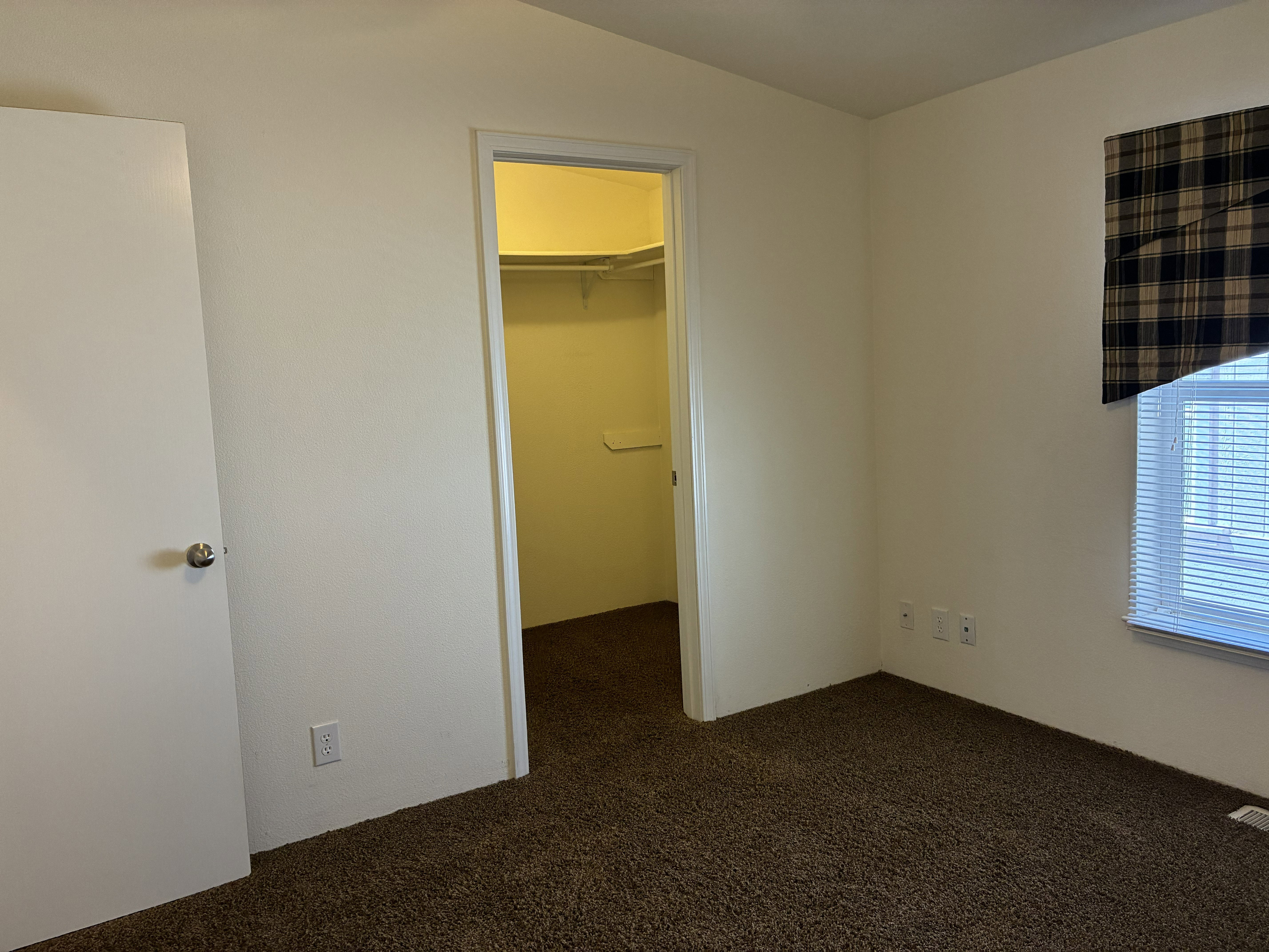 Bedroom 2 featuring a walk-in closet