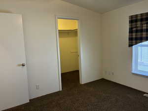 Bedroom 2 featuring a walk-in closet