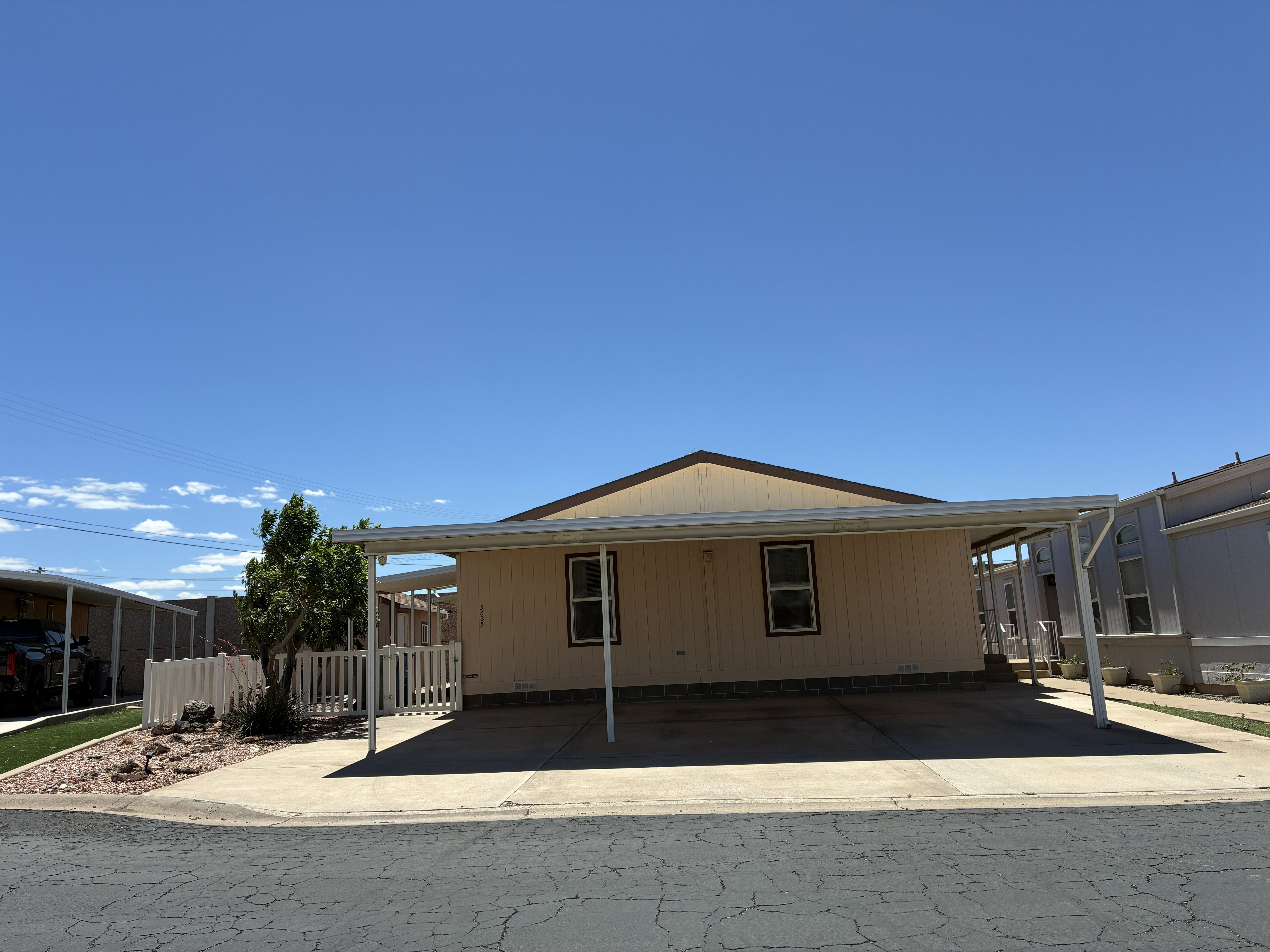 Exterior with a 3-car covered carport