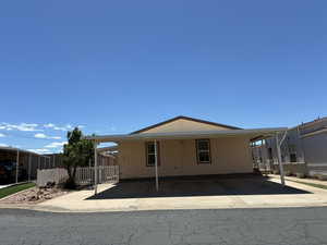 Exterior with a 3-car covered carport