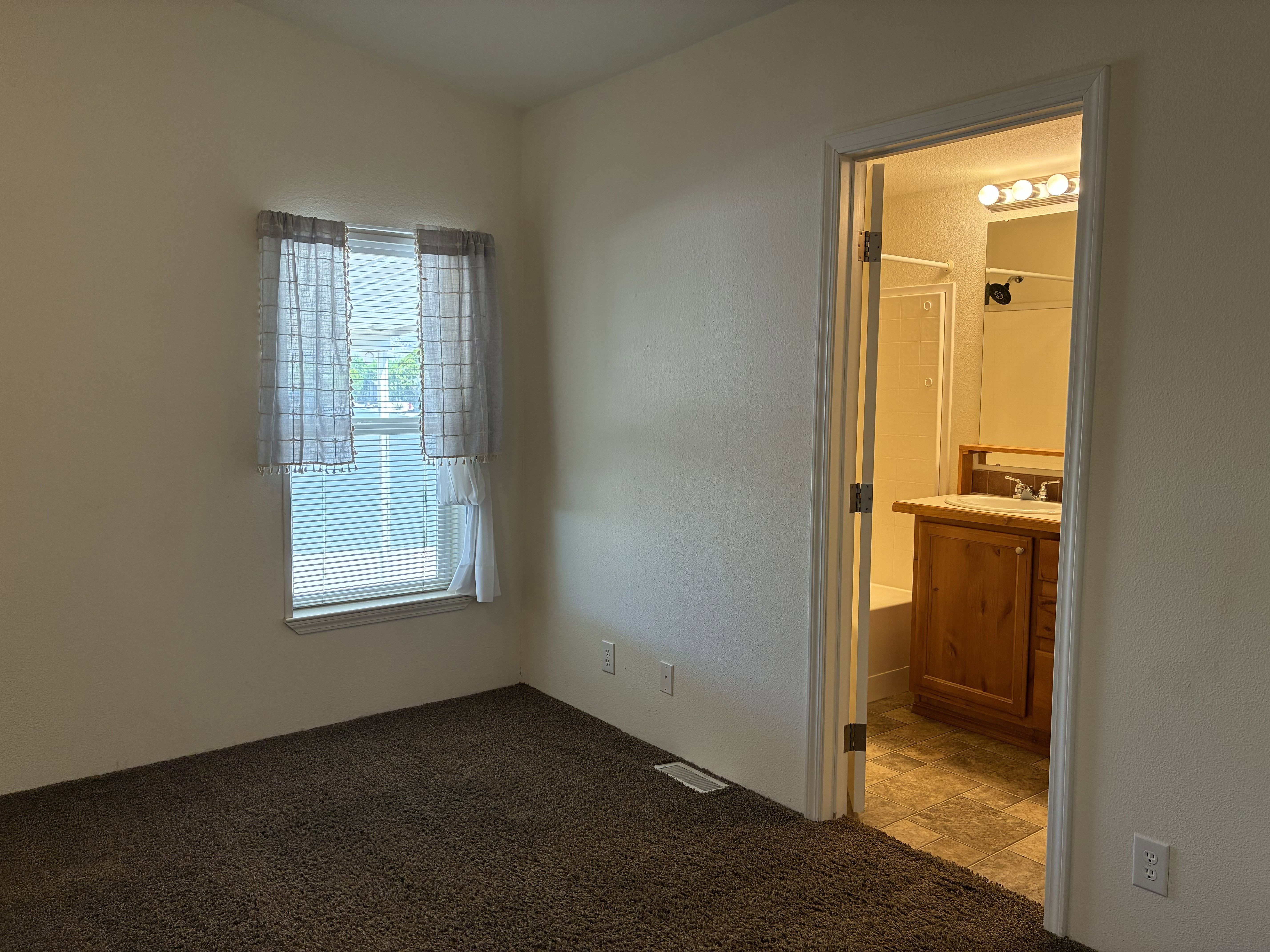 Primary bedroom with two windows