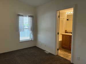 Primary bedroom with two windows