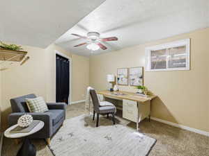 Versatile room featuring a ceiling fan, window, and carpeted flooring