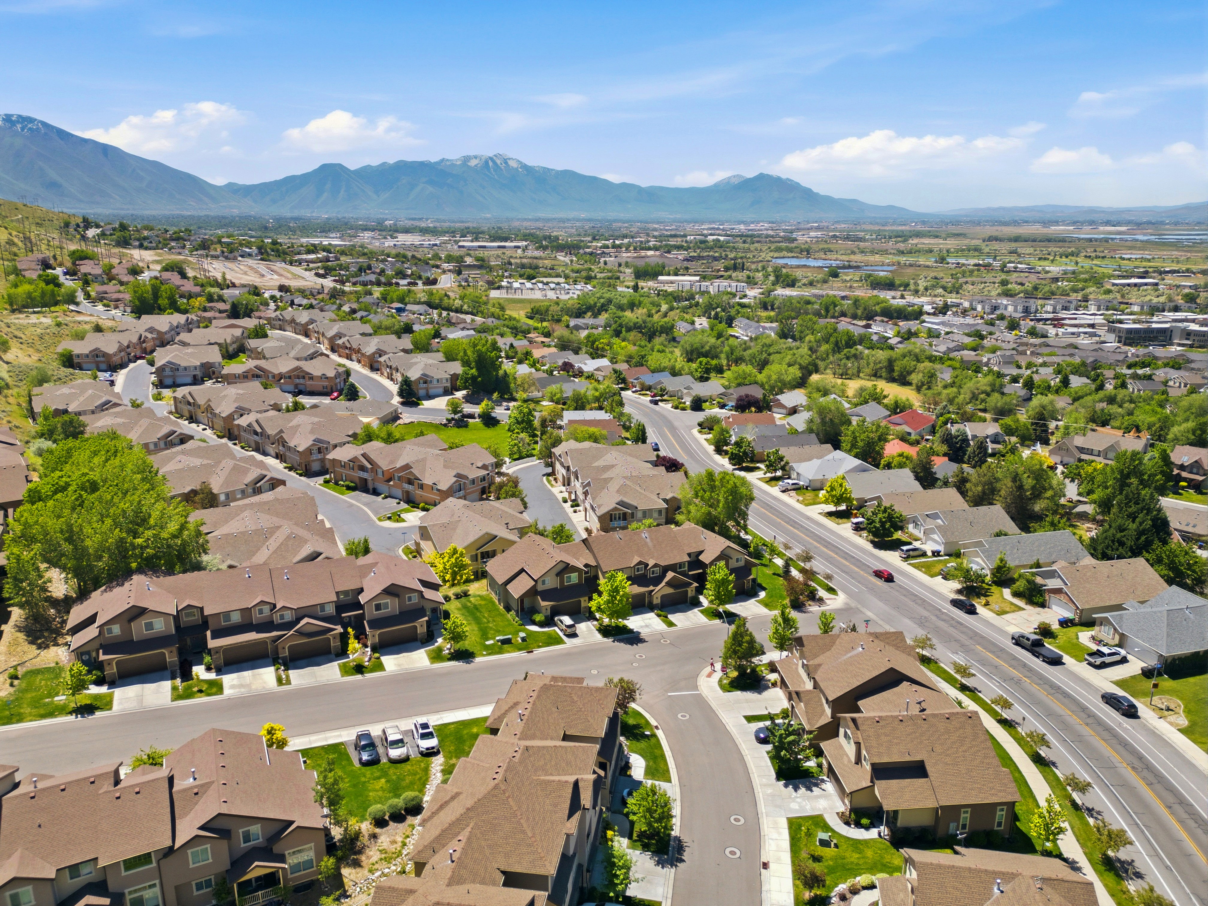 Residential area featuring a variety of properties with brown-toned roofs