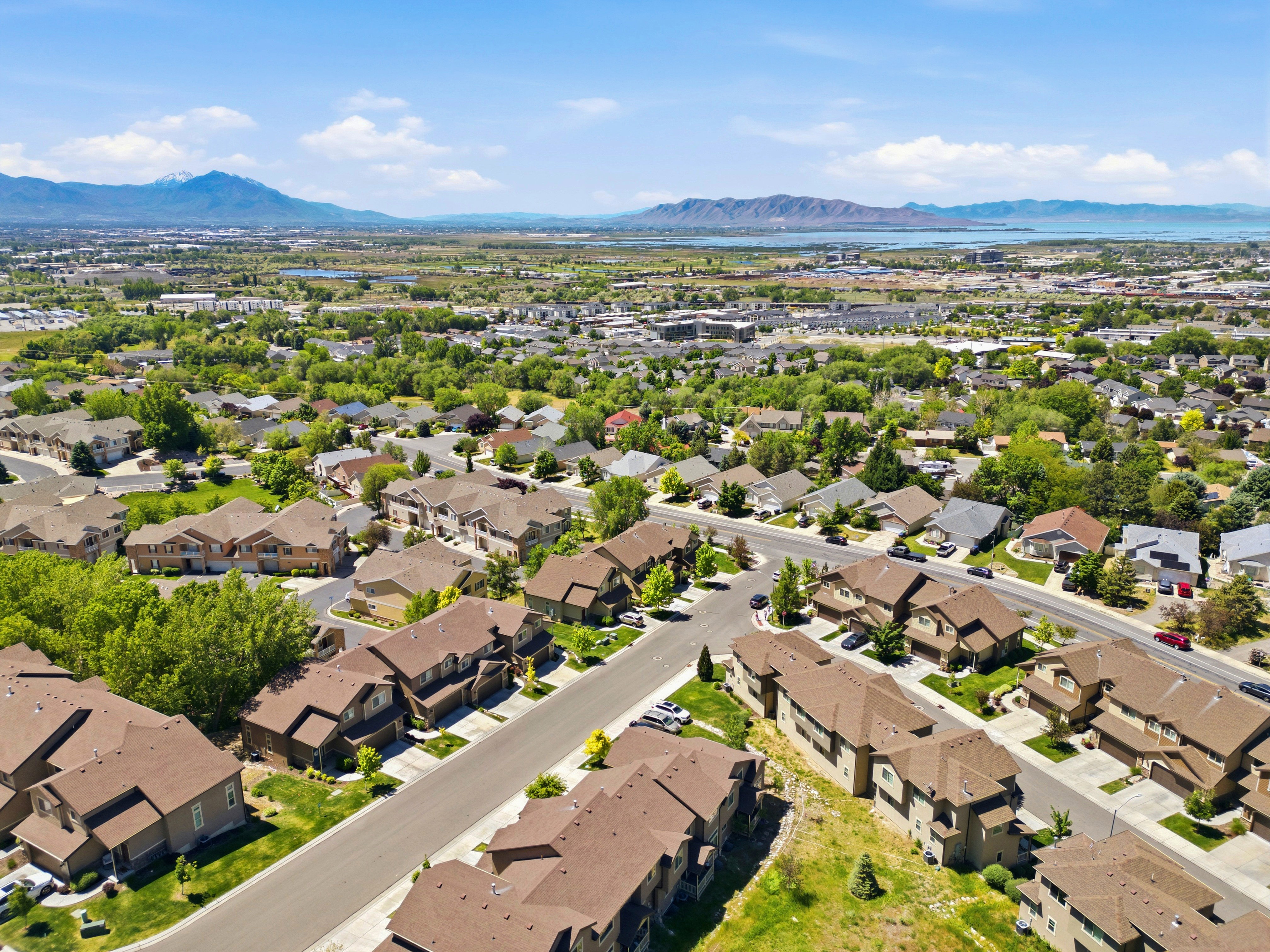 Expansive aerial perspective showcasing a residential neighborhood with varied architecture and mature landscaping