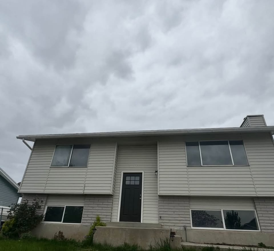 Split foyer home with brick siding
