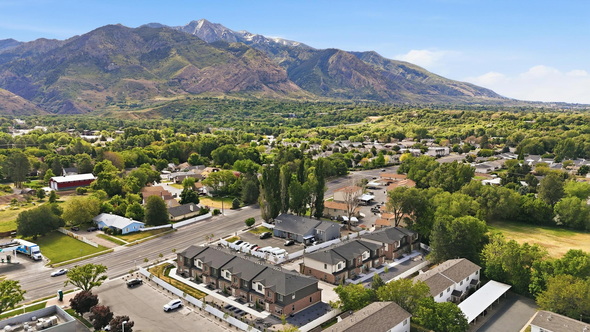 Modern townhome community featuring multi-story residences with a uniform architectural style