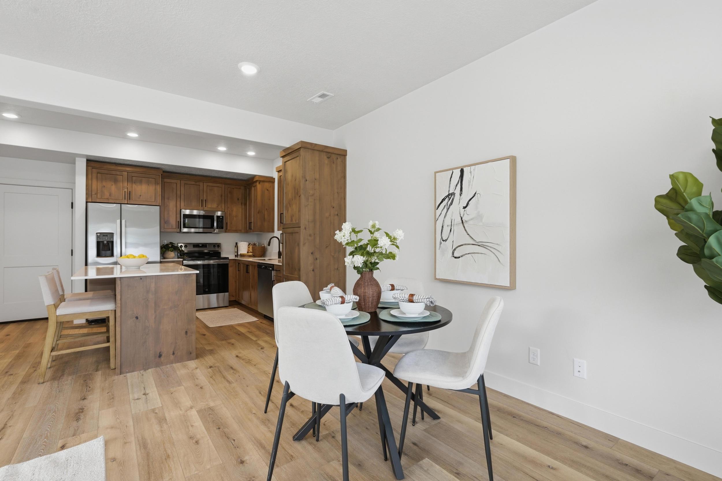 Open-concept living area with light wood-finish flooring