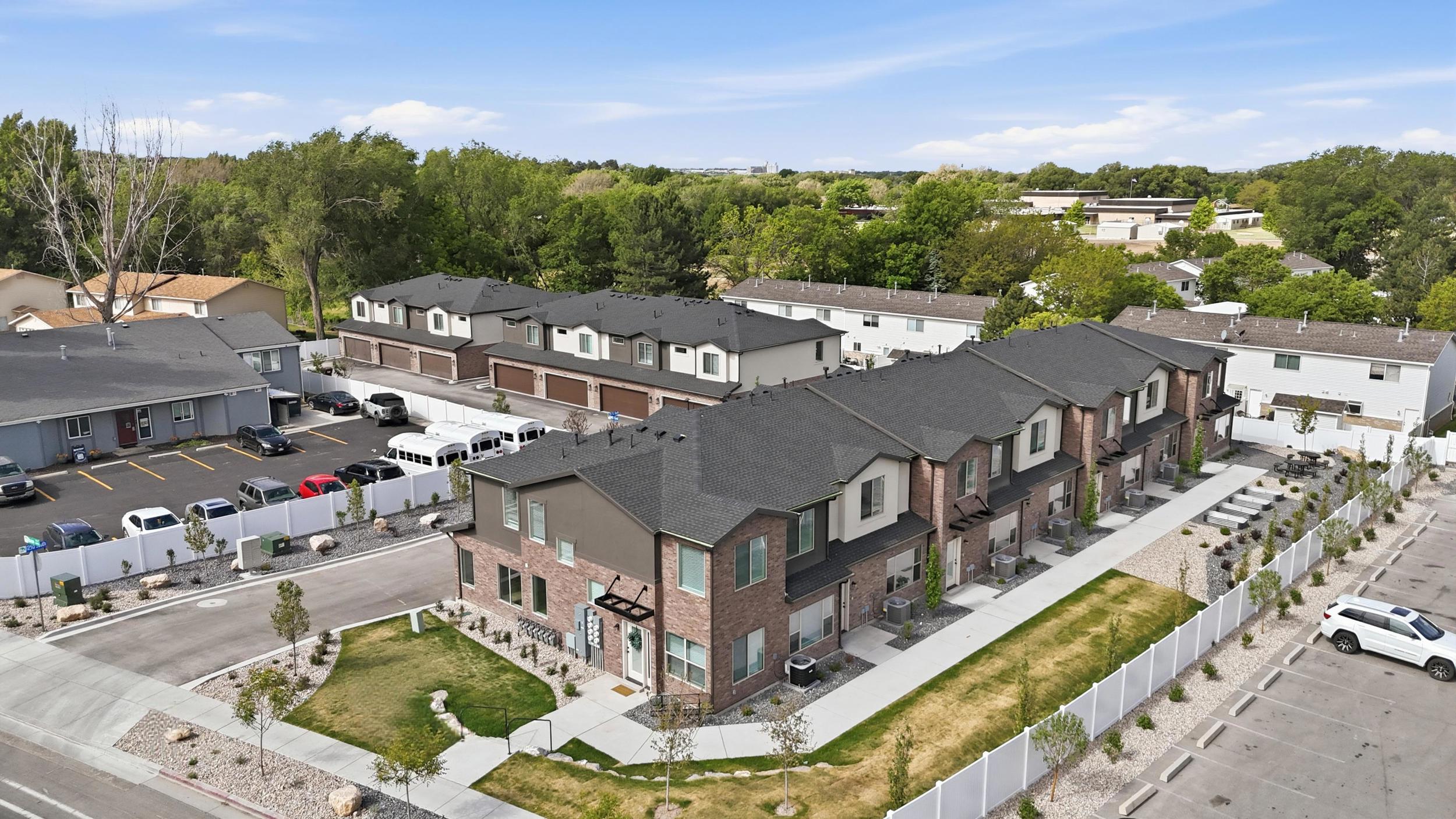 Modern townhome development featuring a brick and siding exterior